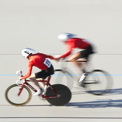 People cycling at an elite level